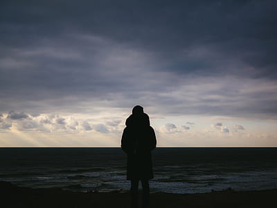 silhouette photo of person facing the horizon thumbnail