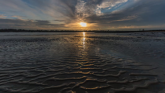 body of water under golden hour thumbnail