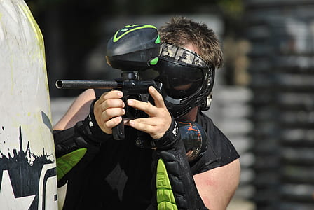 man holding paintball marker thumbnail