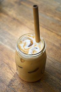 yellow liquid in clear glass with straw thumbnail
