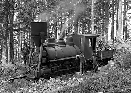 grayscale photography of people standing outside train thumbnail