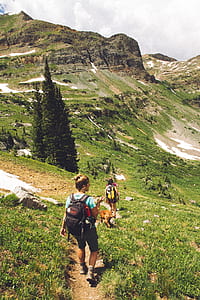 woman walking down from mountain photography thumbnail