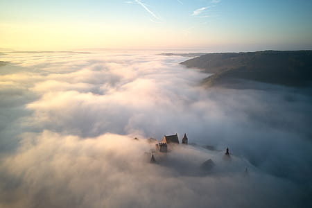 sea of clouds passing through houses thumbnail