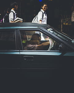 man in car reading newspaper thumbnail
