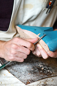 man holding blue shoes frame thumbnail
