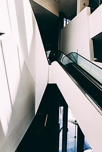 white and black escalator inside building thumbnail