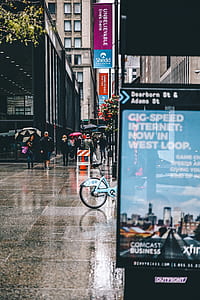 people walking at the sidewalk while raining thumbnail