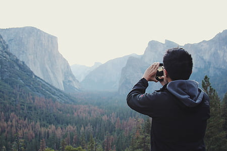 man holding camera thumbnail