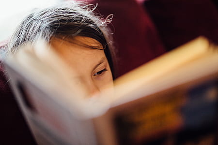 macro shot of girl while reading thumbnail