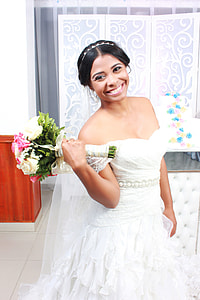 woman in white sweetheart neckline wedding dress taking selfie thumbnail