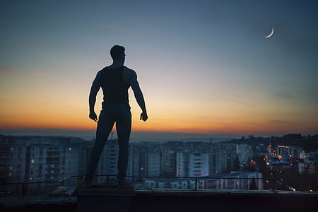 man standing and looking at the buildings thumbnail