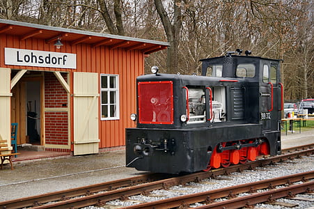 black tren near brown house thumbnail