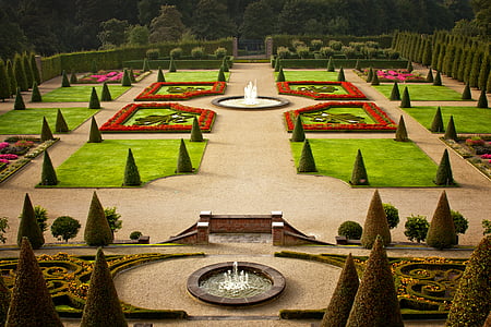 in distant photo of garden with water fountains thumbnail