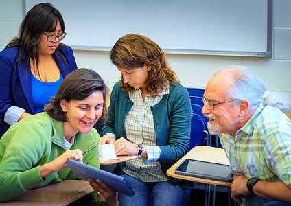 group of people sitting on chairs near dry erase board thumbnail