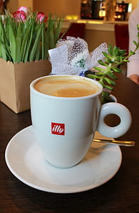 Cup of Illy branded coffee - Illycaffe is an Italian coffee roasting company specializing in espresso - Editorial Use Only thumbnail
