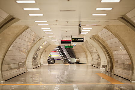 tunnel corridor with escalator and lights turned-on thumbnail