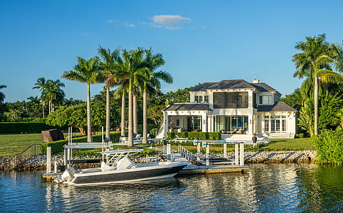 white boat near dock during daytime thumbnail