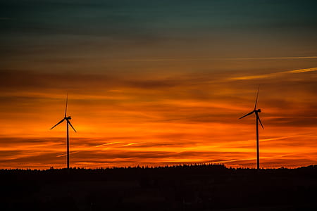 Silhouette of Windmills Under Orange Sunset thumbnail