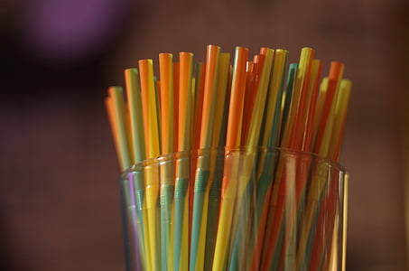 yellow and orange straws in clear glass thumbnail