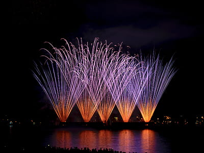time lapse photography of building with fireworks display thumbnail