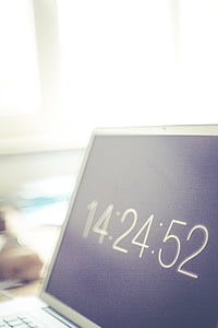 turned-on gray laptop computer with 14:24:52 display thumbnail