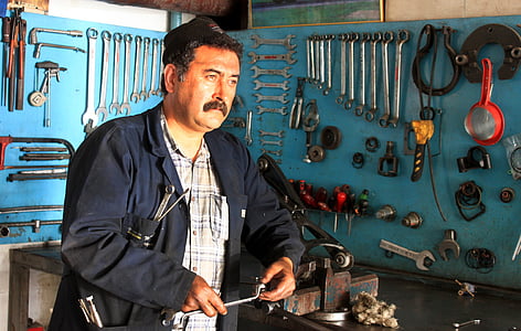 man leaning on brown bench vise thumbnail