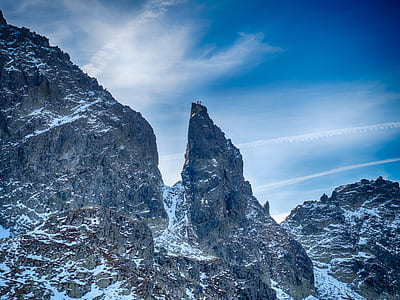 snow-covered mountain under cloudy sky thumbnail