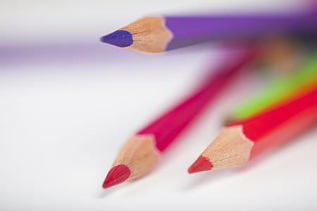 three red, pink, and purple color pencils thumbnail