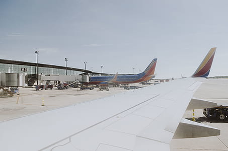 blue and red airliner on airport thumbnail