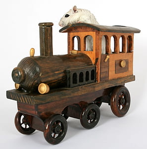 white mouse riding on brown and orange wooden train decor thumbnail