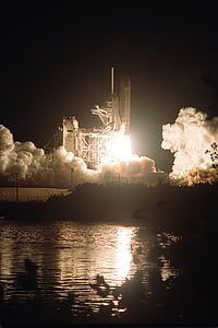 rocket ship during night time thumbnail