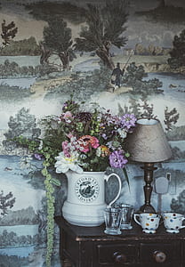 variety of flowers in vase at sideboard thumbnail