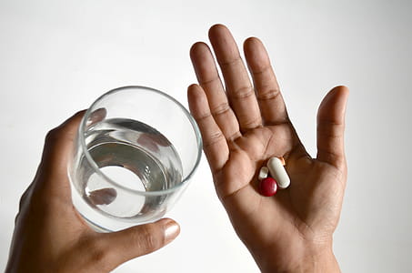 Glass of water and medicine thumbnail