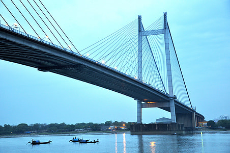 grey bridge with boats under thumbnail
