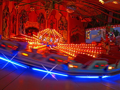 carnival ride with blue and red lights thumbnail