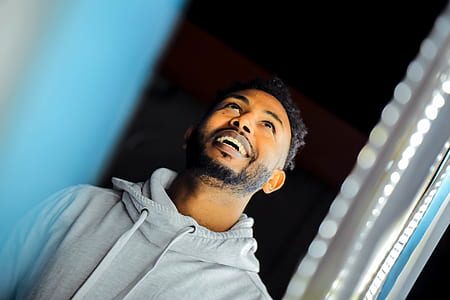 man in gray pullover hoodie looking up thumbnail