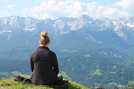 woman on mountain during daytime thumbnail
