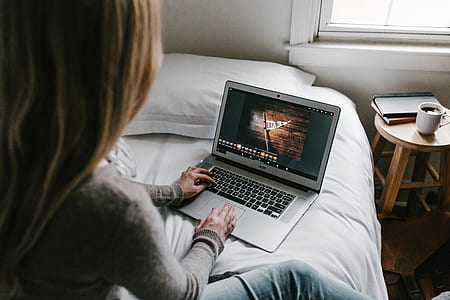 photo of woman typing on white laptop thumbnail