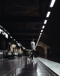 man standing on train station thumbnail