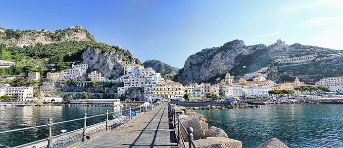bridge across buildings at daytime thumbnail