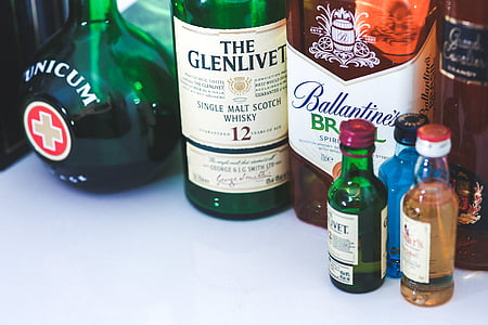 assorted wine bottles on white surface thumbnail