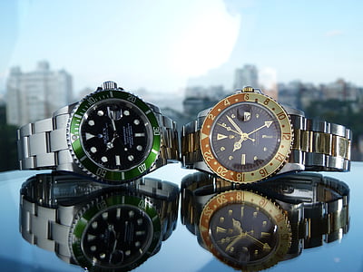 two round green and yellow analog watches thumbnail