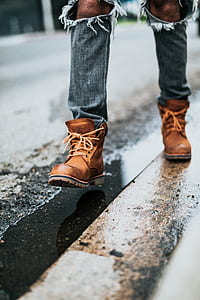 close up photography of person walking on road thumbnail