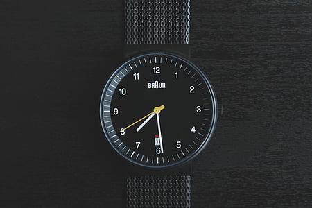 round black Braun analog watch at 7:29 thumbnail