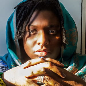 Woman With Dreaded Hair Wearing Green Hijab thumbnail