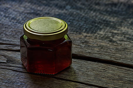 clear glass jar on brown wooden table thumbnail