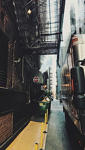 grey bus on concrete road thumbnail