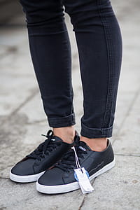 Person Wearing Black Pants And Pair Of Black Sneakers thumbnail