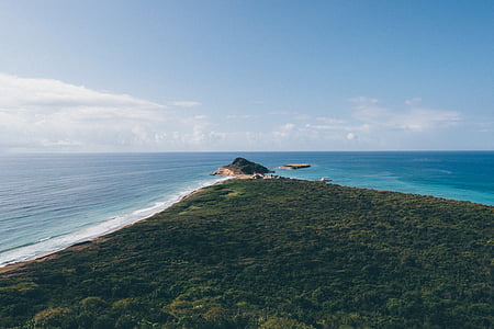 island in the middle of ocean during daytime thumbnail