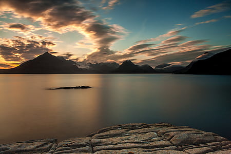 body of water under blue and white cloud thumbnail